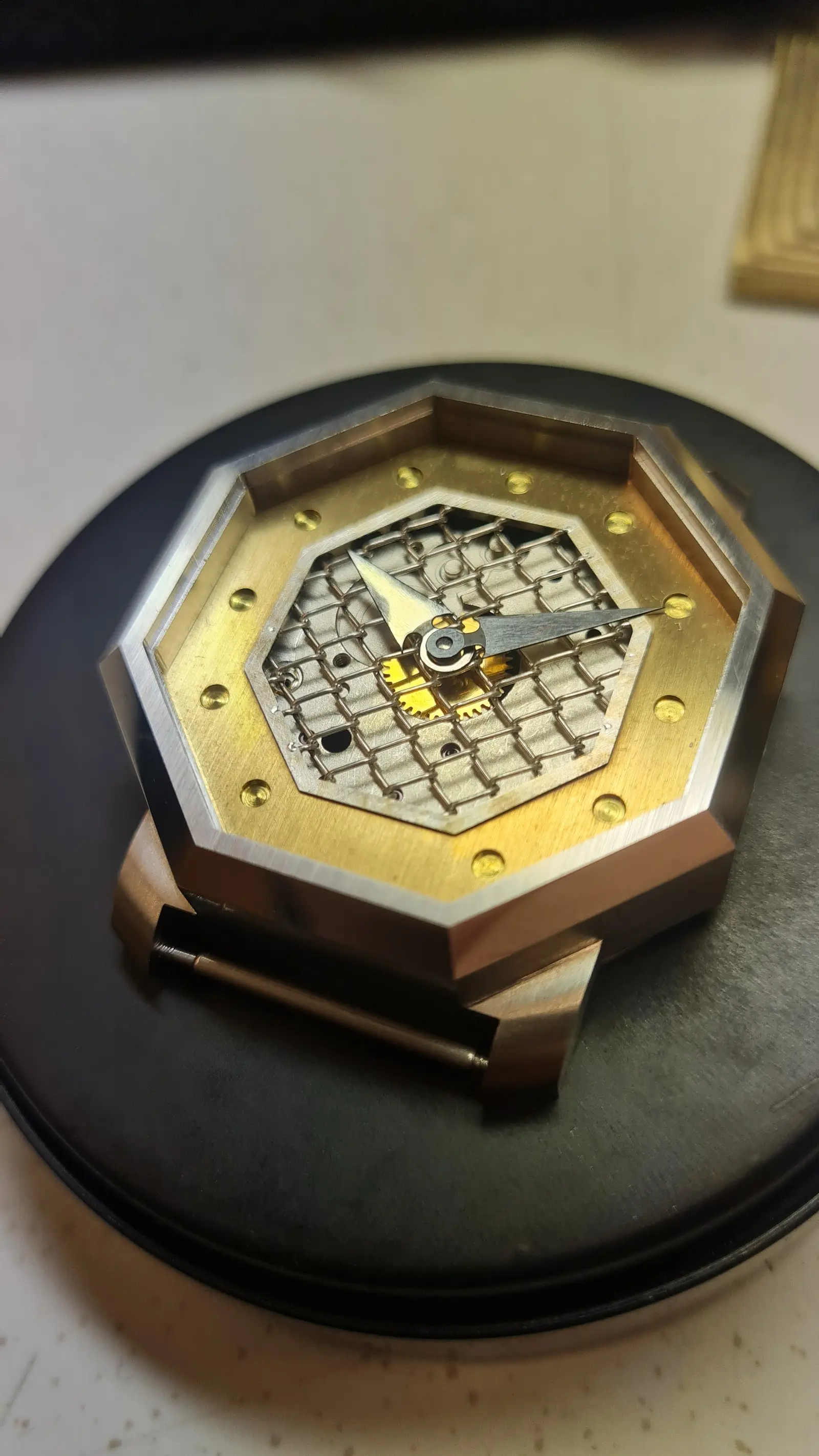Dial and movement assembly in progress at the Reigi bench