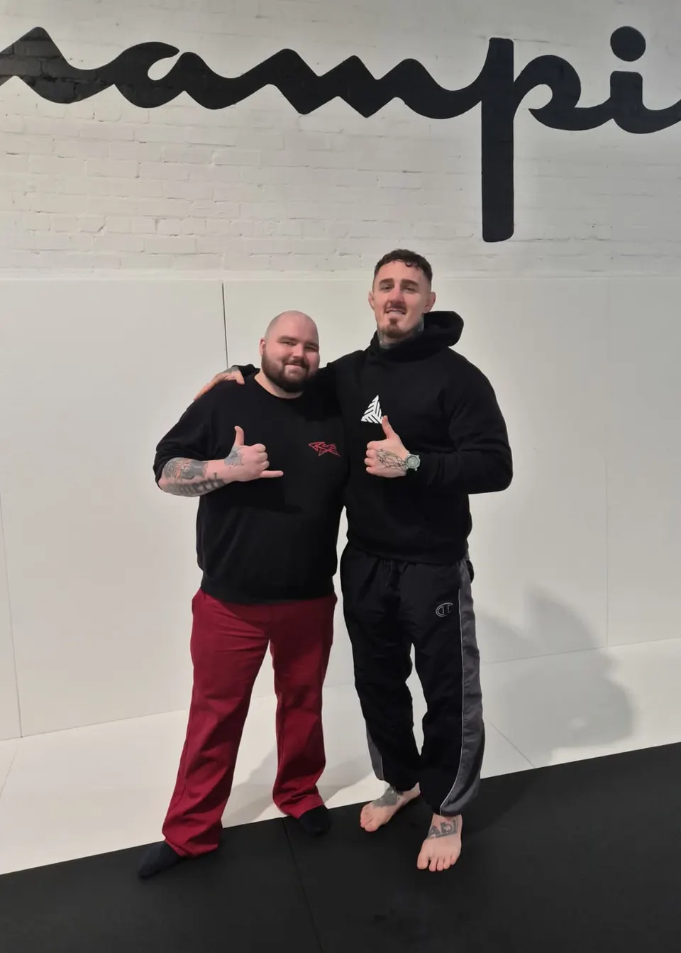 Julli Huikkonen and Tom Aspinall at the gym