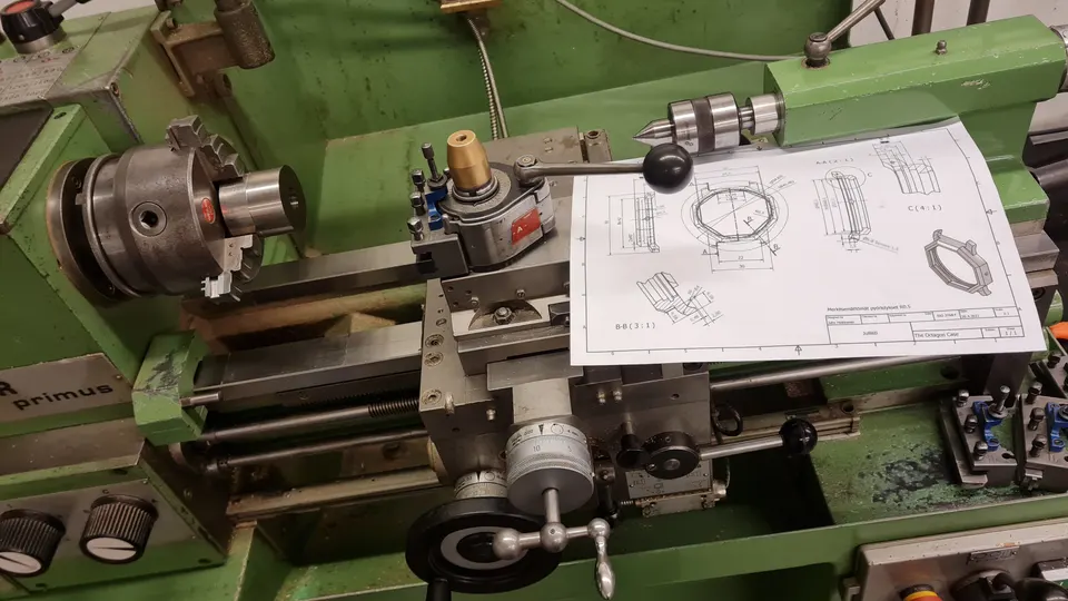 Working drawings beside the lathe at the Reigi atelier