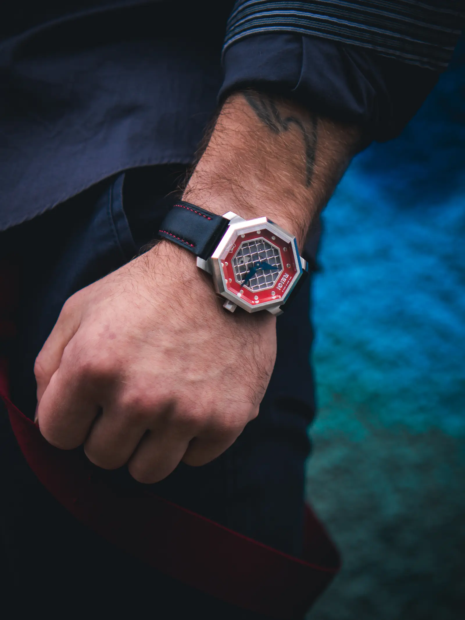 The Octagon — Red Cornerstone on the wrist